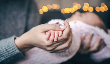 Mother Holding New born Baby hand - Baby Care 